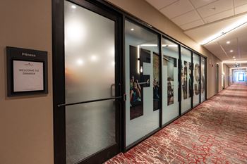 A hallway with a sign that says